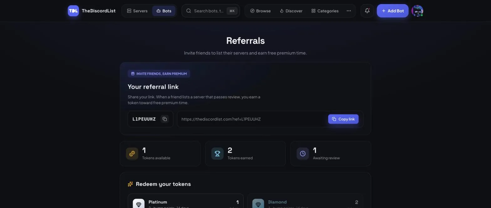 The referrals page showing a personal referral code, a shareable link with a copy button, and counters for tokens available, tokens earned and referrals awaiting review